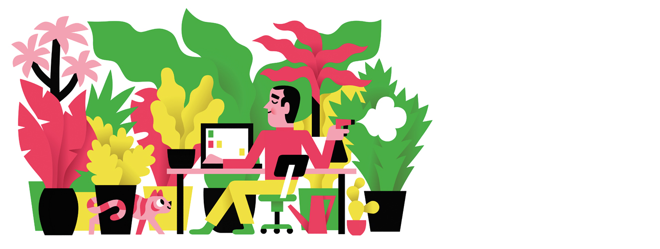 Ein Mann sitzt an einem Schreibtisch vor seinem Computer und arbeitet, während er seine Pflanzen im Raum genießt