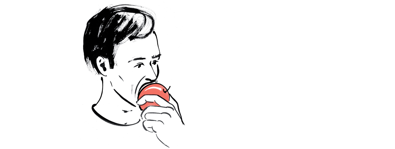 Ein Mann beißt geräuschvoll in einem Apfel und verursacht bei Menschen, die unter Misophonie leiden, Aggressivität